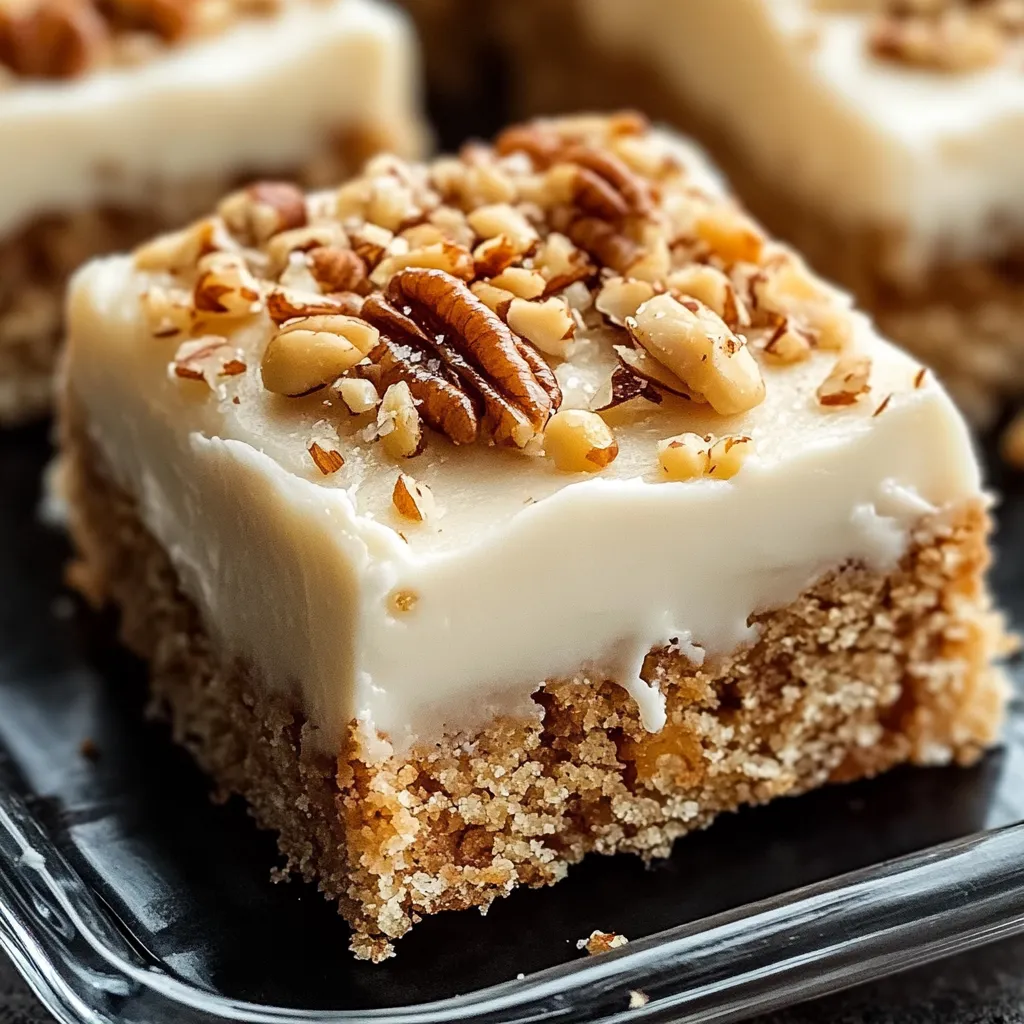 Soft carrot cake bars topped with smooth cream cheese frosting for a delightful bite.